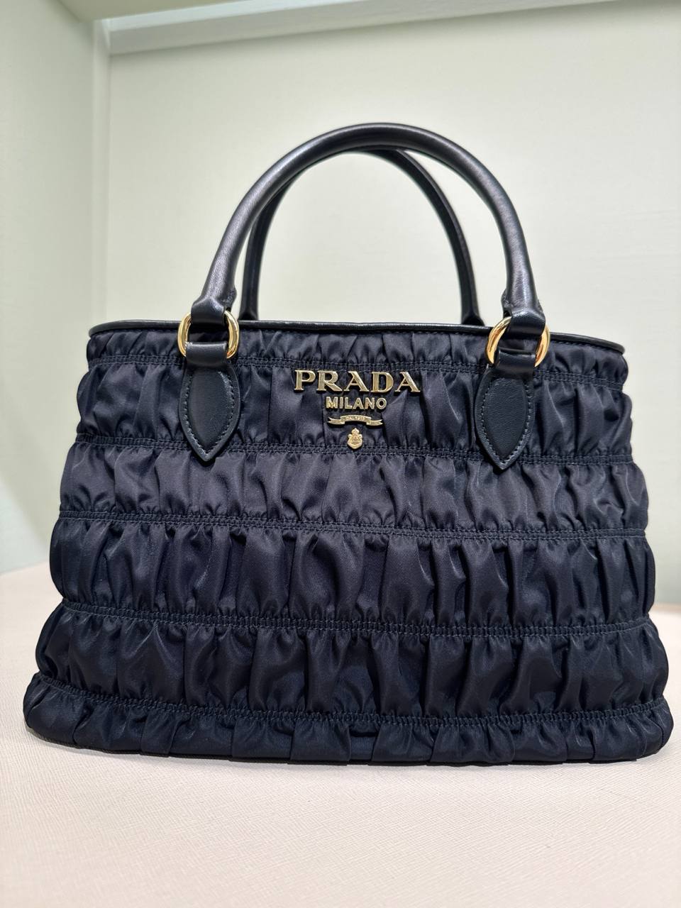 material da bolsa nylon  acompanha alça em couro